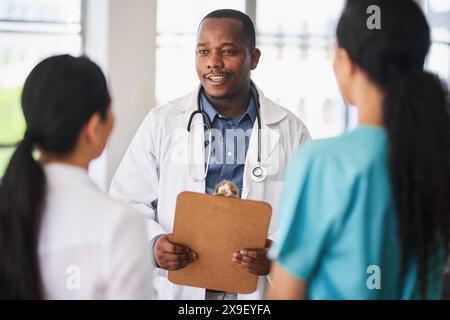 Multi-Ethnic Medical Team in Discussion at Hospital Stock Photo