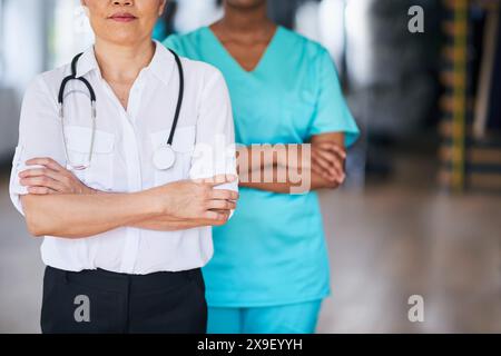 Diverse Medical Professionals Standing Together in a Hospital Stock Photo