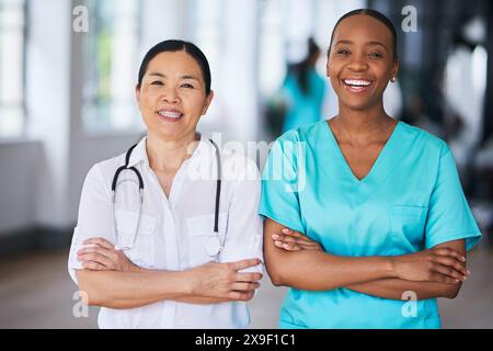 Diverse Medical Team Smiling in Hospital Environment Stock Photo