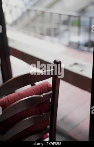 Wooden chair interior modern cozy design by the window cafe restaurant view aesthetic instant shot. Stock Photo