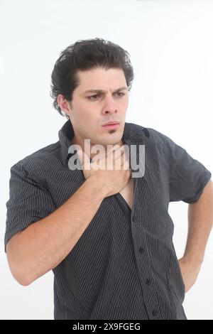 stressed out and worried young man on white background Stock Photo