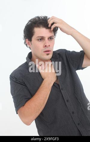stressed out and worried young man on white background Stock Photo