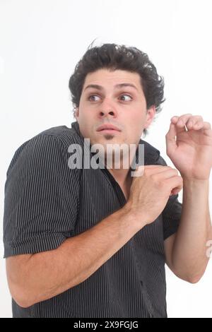 frustrated young man on white background Stock Photo