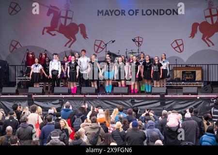 Youngsters from the West End Kids Troupe, performing on stage at the Mayor of London's St. George's Day Celebration in Trafalgar Square, London. Stock Photo