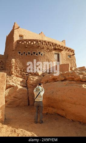 Historian at the ancient mudbrick village in Taghit Stock Photo