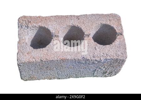 Hollow cinder block isolate on a white background close-up. Stock Photo