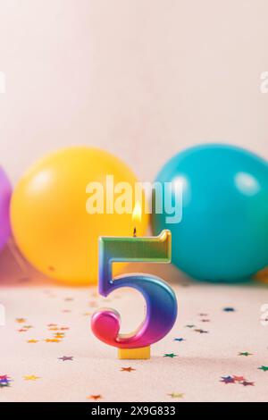 Glowing Number 5 Candle: Birthday Celebration Background Stock Photo