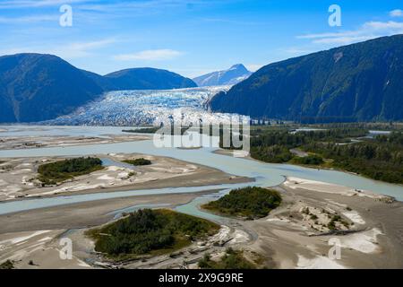 Aerial view of the glaciers located along the Taku Inlet, which are part of the Juneau Icefield in Alaska, USA - Floodplain covered with moraine surro Stock Photo