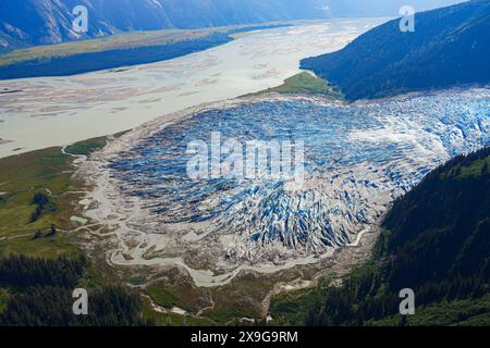 Aerial view of the glaciers located along the Taku Inlet, which are part of the Juneau Icefield in Alaska, USA - Floodplain covered with moraine surro Stock Photo