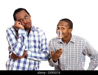 portrait two guys, one being excited, optimistic, and another one bored, annoyed  standing next to each other, isolated white background. Stock Photo