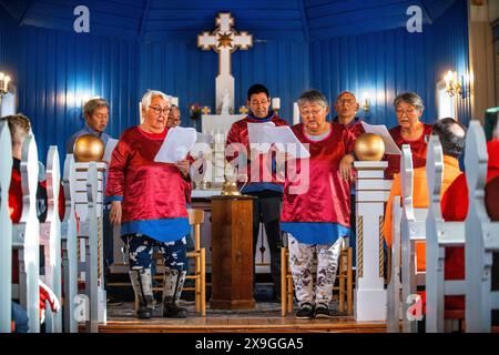 Inuit choir in traditional dresses, Nanortalik church Island of Qoornoq Province of Kitaa Southern Greenland Kingdom of Denmark Polar Regions Stock Photo