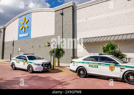 North Miami Beach Florida,Walmart discount department grocery store,outside exterior,Miami-Dade police cars vehicles parked in front,shoplifting crime Stock Photo