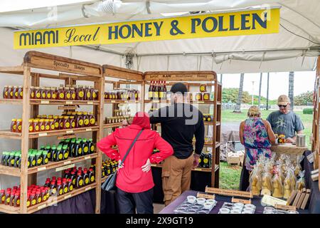 Miami Beach Florida,Lummus Park,Ocean Drive,Art Deco Weekend,celebration street fair annual event,vendor booth pop-up store,local honey pollen,man men Stock Photo