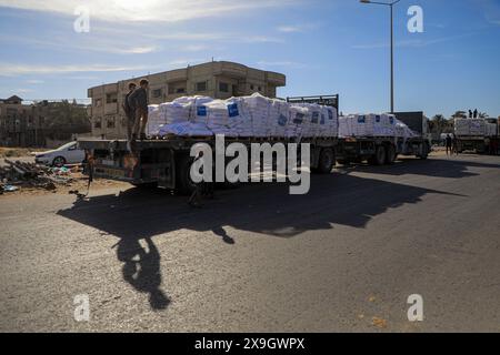 Gaza. 31st May, 2024. Trucks carrying humanitarian aid arrive at a warehouse of the United Nations Relief and Works Agency for Palestine Refugees in the Near East (UNRWA) in the southern Gaza Strip city of Khan Younis, on May 31, 2024. The Hamas-run media office in Gaza on Friday warned of an unprecedented humanitarian disaster in the enclave due to the closure of land crossings. Credit: Rizek Abdeljawad/Xinhua/Alamy Live News Stock Photo