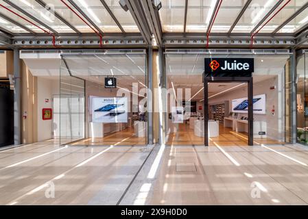 Turin, Italy - May 10, 2024: Juice Apple Store in Lingotto Torino shopping center in the renovated former Fiat car factory, Juice is Apple product and Stock Photo