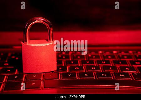 Cybersecurity concept, padlock on laptop computer keyboard Stock Photo