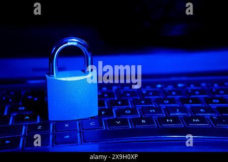 Cybersecurity concept, padlock on laptop computer keyboard Stock Photo