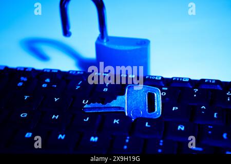 A lock and key on top of the keyboard Stock Photo