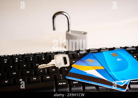 A credit card together with a padlock with a key, security in online shopping. Stock Photo