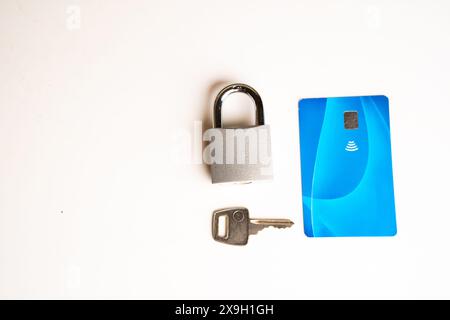 Online shopping security concept, credit cards on a computer keyboard and a padlock with a key. Stock Photo