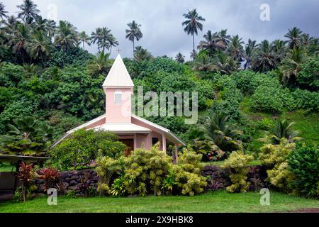 A small pink church at Puama'u, Iipona, on Hiva Oa, Marquesas Islands, French Polynesia Stock Photo