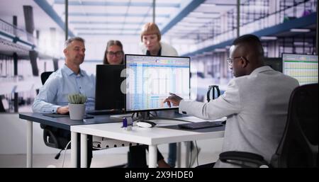 Data Analyst African Woman Using Spreadsheet On Computer Stock Photo