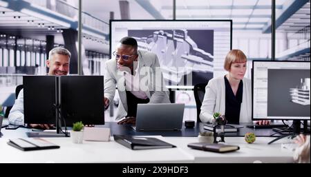 Engineers Doing 3D CAD Model Design On Computer Stock Photo
