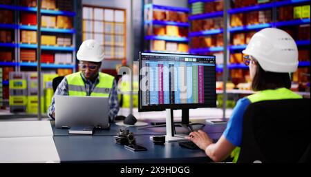 Digital Warehouse And Logistics Store. Staff Working Stock Photo