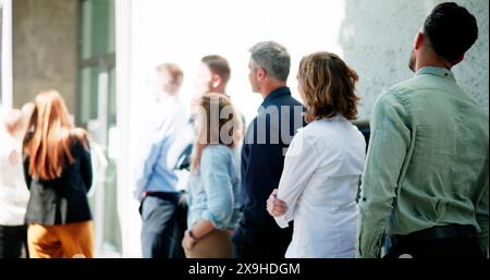 Queue Outdoors. Business People Waiting In Line Stock Photo