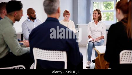 Multiethnic People Reading Bible In Group Circle Stock Photo