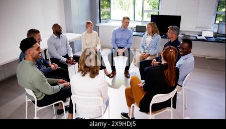 Business Communication In Office And Teamwork. Sitting Meeting Stock Photo