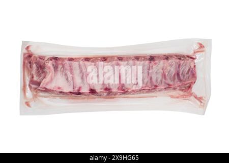 Pork meat ribs vaccuum packaged isolated on white background. Fresh pork meat ribs for barbecue. Strip of pork meat on ribs. BBQ pork ribs isolated ov Stock Photo