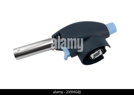 Manual gas torch burner isolated on white background. Flame gun blow torch for camping. Blowtorch to gas bottle isolated. Stock Photo