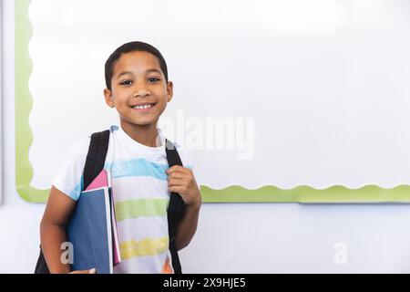 Biracial boy ready for school, with copy space Stock Photo