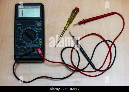 multi meter and electric tester on a wooden table Stock Photo