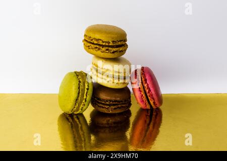 colorful macaroons on a wooden table Stock Photo