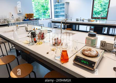 Equipment for a chemistry lab are displayed on a table in a laboratory. Stock Photo
