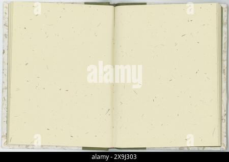 Empty handmade paper for writing or drawing in an open book. Stock Photo