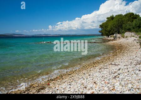 Pebbled beach on th eisland of Zlarin, Croatia Stock Photo