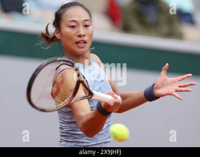 (240601) -- PARIS, June 1, 2024 (Xinhua) -- Zheng Qinwen of China hits a return to Elina Avanesyan of Russia during the women's singles third round match at the French Open tennis tournament at Roland Garros in Paris, France, June 1, 2024. (Xinhua/Gao Jing) Stock Photo