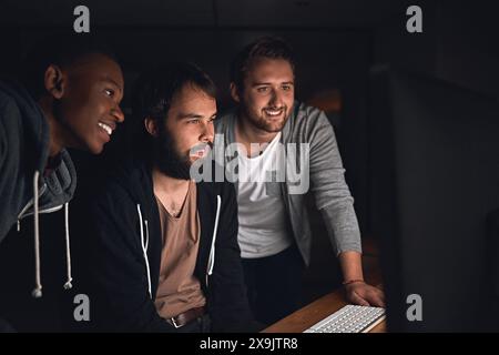 Happy, men and programmers for software development, coding and collaboration at night in office. Smile, people and web design for app project meeting Stock Photo