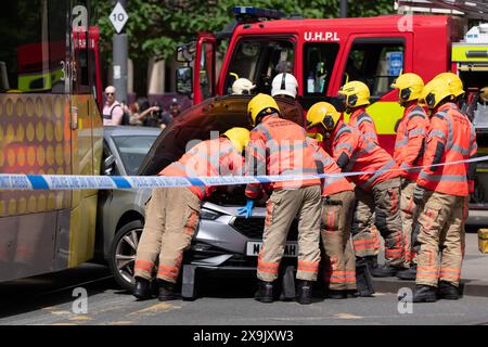 A car crashed into a tram in St Peters square after traffic was stopped in the centre due to a Palestinian demonstration in Manchester city centre. The protest saw protesters pass down Market street passing a Barclays Bank branch which has been boarded up after windows were smashed and the building was covered in red paint as part of a protest againts the Banks involvement with investment in Israel. Manchester, UK Picture: garyroberts/worldwidefeatures.com Stock Photo