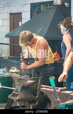 SHEPTON MALLET, SOMERSET, UK. 1st June, 2024,  close up and detail shots Farriers making horseshoes in forges and fitting them to horses in the  apprentice class shoeing at the Royal Bath and West Show 2024. Credit John Rose/Alamy Live News Stock Photo