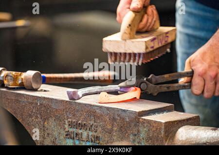 SHEPTON MALLET, SOMERSET, UK. 1st June, 2024,  close up and detail shots Farriers making horseshoes in forges and fitting them to horses in the  apprentice class shoeing at the Royal Bath and West Show 2024. Credit John Rose/Alamy Live News Stock Photo