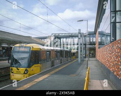 Bee Network Metrolink tram to Manchester Piccadilly as seen at Altrincham Interchange Stock Photo