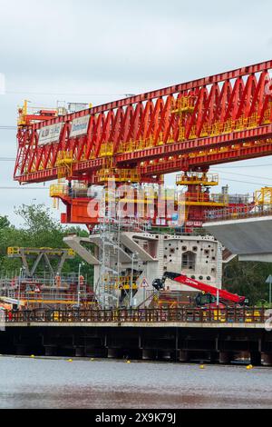 Harefield, UK. 1st June, 2024. HS2 are continuing work on the High Speed Rail 2 Colne Valley Viaduct in Harefield, London Borough of Hillingdon. The huge orange bridge building machine, Dominique, called a launching girder has now crossed over the  Grand Union Canal in Harefield and work on the viaduct is continuing above the lake (pictured) that used to house the Hillingdon Outdoor Activities Centre (HOAC). The Club were evicted by HS2 and remain without premises. Credit: Maureen McLean/Alamy Live News Stock Photo