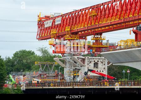 Harefield, UK. 1st June, 2024. HS2 are continuing work on the High Speed Rail 2 Colne Valley Viaduct in Harefield, London Borough of Hillingdon. The huge orange bridge building machine, Dominique, called a launching girder has now crossed over the  Grand Union Canal in Harefield and work on the viaduct is continuing above the lake (pictured) that used to house the Hillingdon Outdoor Activities Centre (HOAC). The Club were evicted by HS2 and remain without premises. Credit: Maureen McLean/Alamy Live News Stock Photo