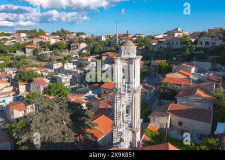 Picturesque view of a historic village of Lofou featuring a prominent stone bell tower and traditional houses. Limassol District, Cyprus Stock Photo