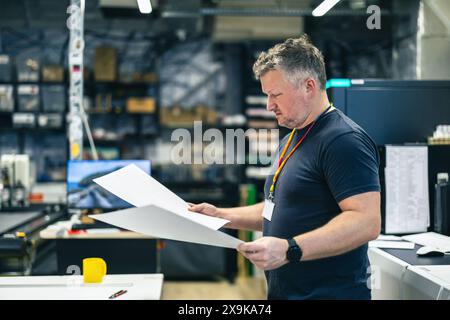 Man working in a printing factory Stock Photo