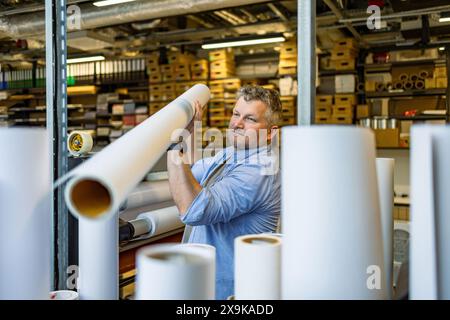 Man working in a printing factory Stock Photo